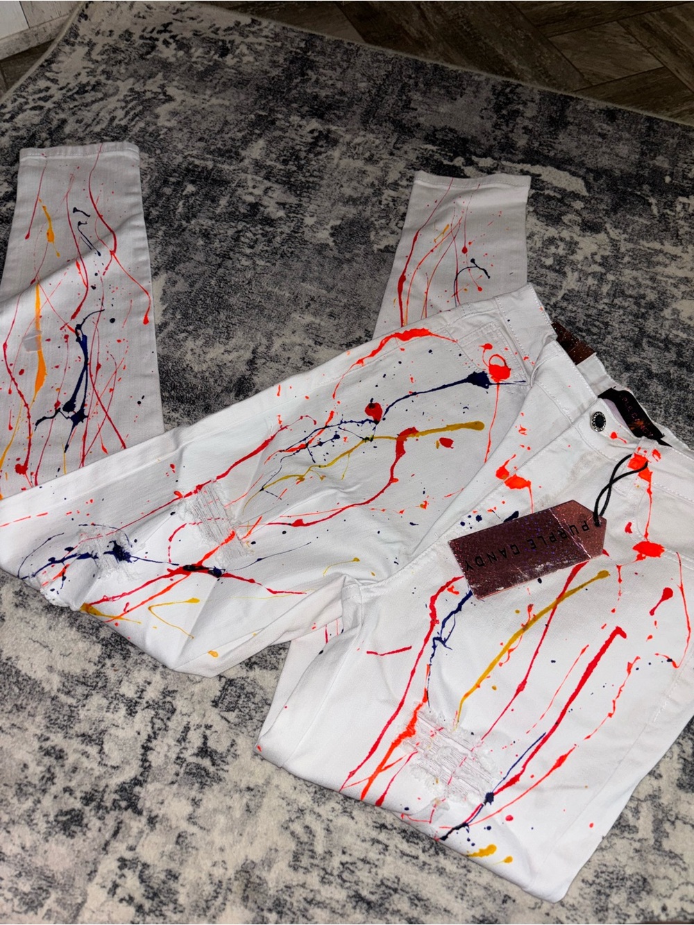 Paint splatter woman’s jeans